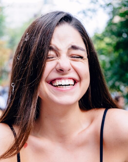 Photo by Vicky Hladynets woman in black spaghetti strap top smiling